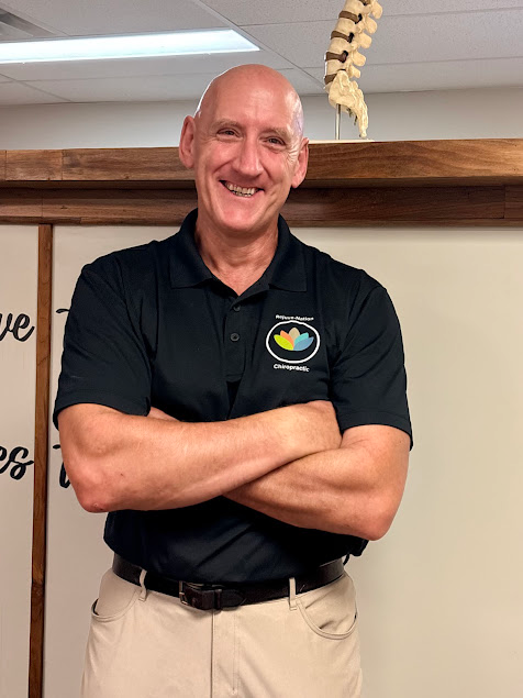 Dr. Paul Given standing in the clinic